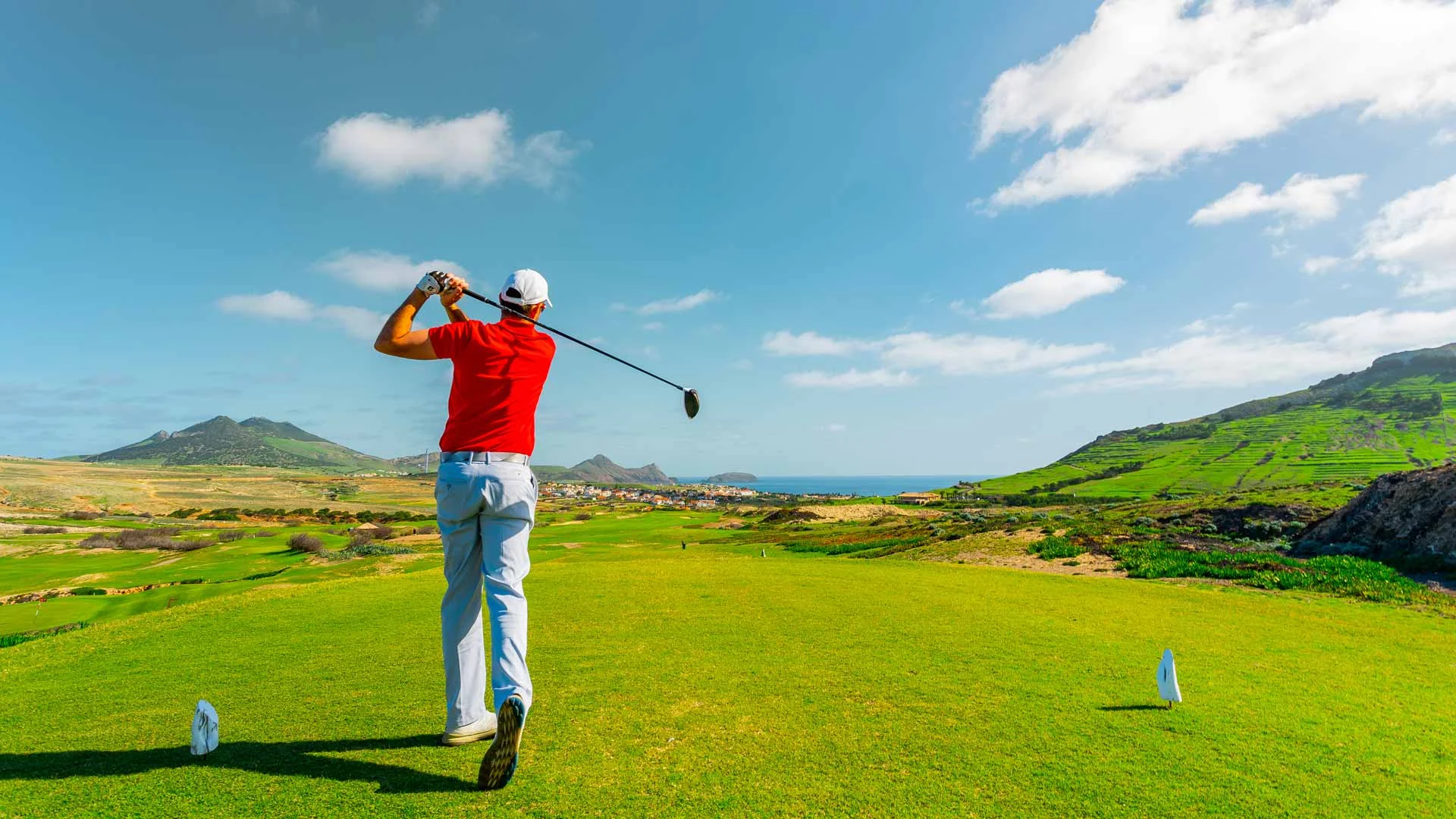 Man on Gold Course Hitting Tee Shot